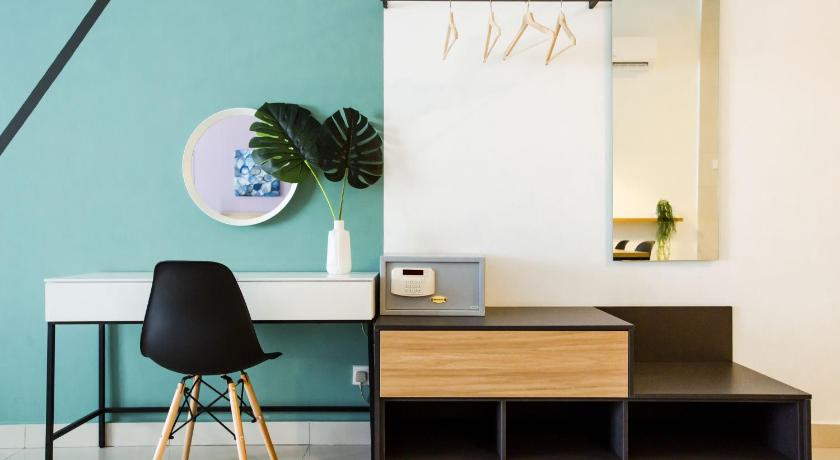 a chair and a desk in a room, Da Men Subang Sunway by ODY Suites in Kuala Lumpur