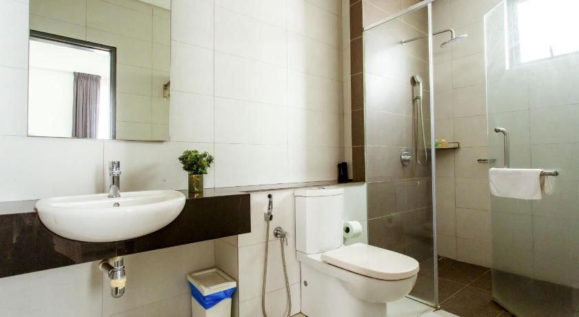 a white toilet sitting next to a sink in a bathroom, Da Men Subang Sunway by ODY Suites in Kuala Lumpur