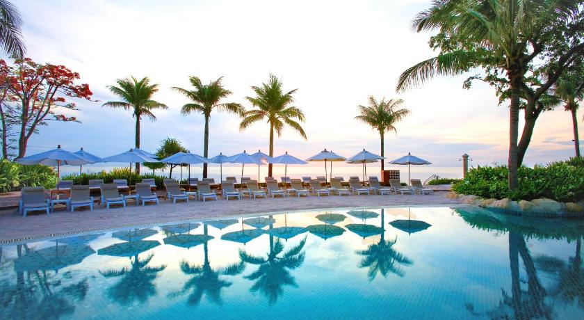 a beach with palm trees and palm trees, Hyatt Regency Hua Hin Hotel (SHA Plus+) in Hua Hin / Cha-am