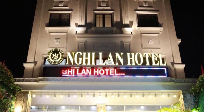 a large building with a clock on the front of it, Nghi Lan Hotel in Phú Quốc Island