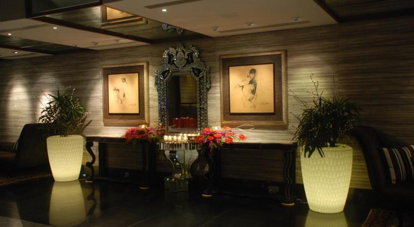 a living room filled with furniture and a table, The Lalit Great Eastern Kolkata in Kolkata