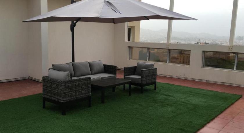 a living room with a couch, chairs and a table, Dar Telal Hotel suites in Abha
