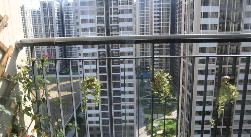 a view from a balcony of a city with tall buildings, Vinhomes Ocean Park - Workstay Apartment in Gia Lam