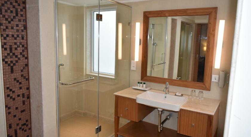 a bathroom with two sinks and a mirror, Welcomhotel by ITC Hotels, Bay Island, Port Blair in Andaman and Nicobar Islands