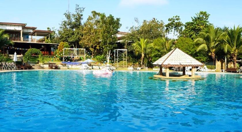 a large swimming pool in a tropical setting, Nakakiri Resort and Spa in Kanchanaburi