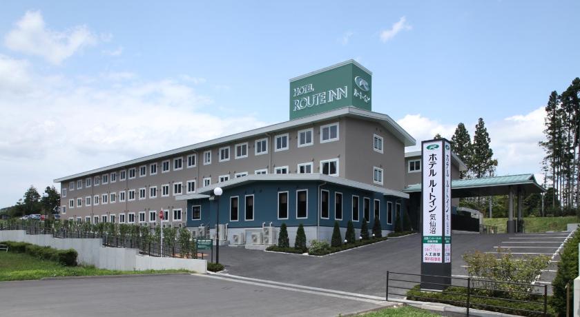 a large building with a sign on the side of it, Hotel Route Inn Kesennuma Chuo Inter in Ishinomaki