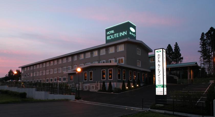 a large building with a clock on the front of it, Hotel Route Inn Kesennuma Chuo Inter in Ishinomaki