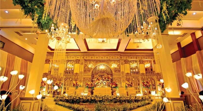 a large room filled with lots of lights and decorations, Hermes Palace by BENCOOLEN in Aceh