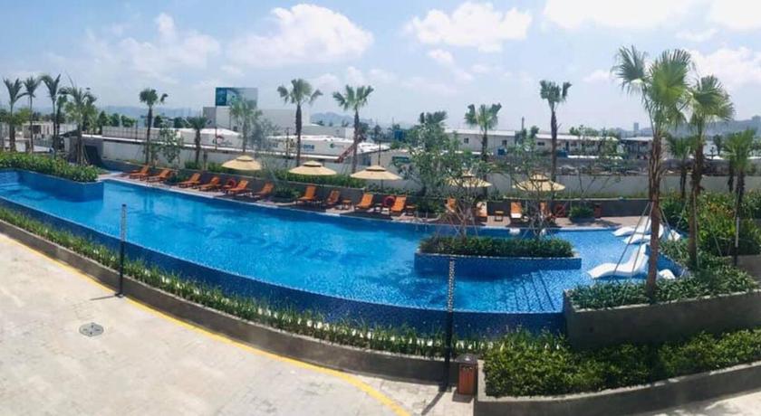 a swimming pool filled with lots of people, BOM HOMES- THE SAPPHIRE HA LONG RESIDENCE APARTMENt in Hạ Long