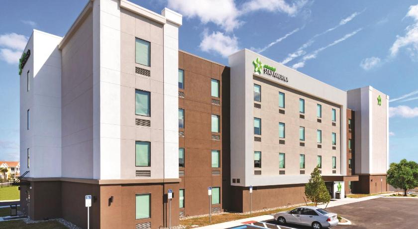 a large brick building with a large window, Extended Stay America Premier Suites - Melbourne - Palm Bay in West Melbourne