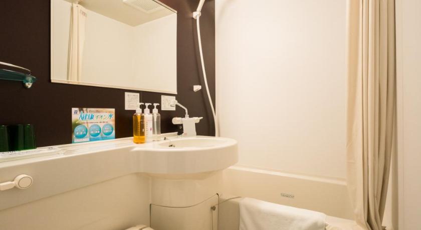 a bathroom with a toilet a sink and a bathtub, Super Hotel Fujinomiya in Gotemba
