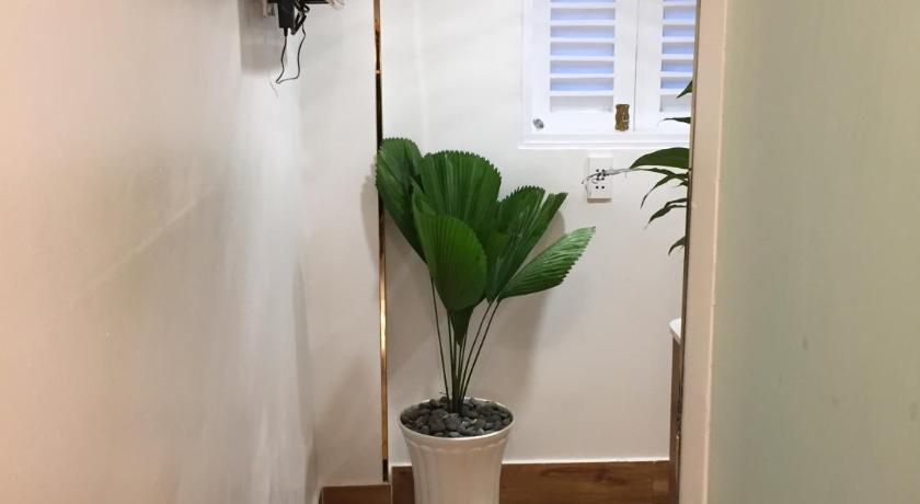 a bathroom with a toilet and a plant in it, An Nam Corner - Dreamer in Ho Chi Minh City