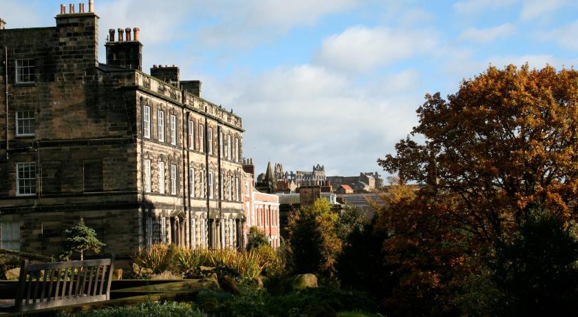 a large building with a clock tower on top of it, Teesdale Rooms in Whitby