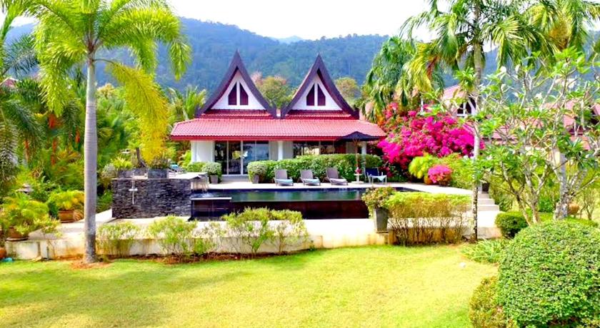 an outdoor patio with a large garden and trees, Koh Chang Beach Front 5 Bedroom Villa in Koh Chang