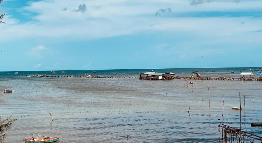 boats floating on top of a body of water, Aurora Beach House in Phu Quoc Island