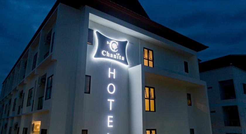 a large building with a clock on the front of it, Chanita Hotel Chumphon in Chumphon