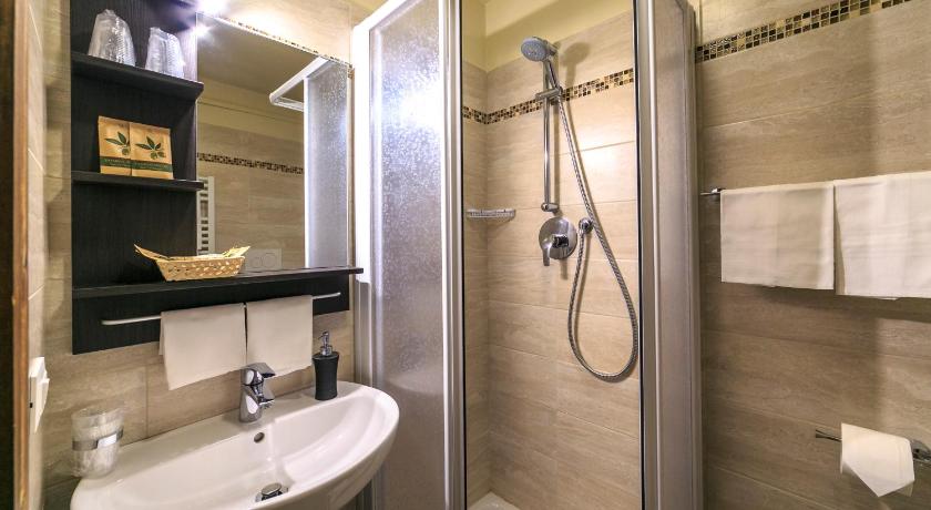 a bathroom with a shower, sink, and toilet, Hotel Meuble Furggen in Valtournenche