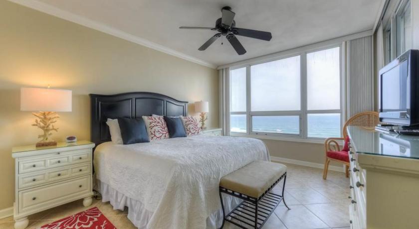 a bedroom with a bed and a dresser, Hidden Dunes in Destin (FL)