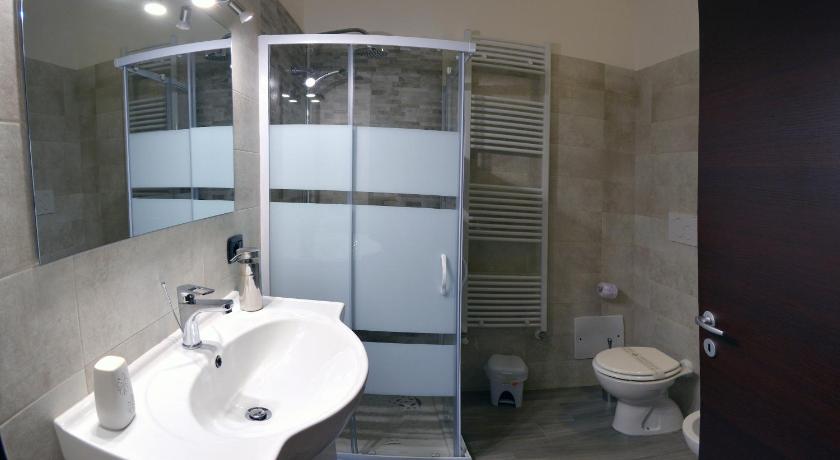a bathroom with a sink, toilet and shower, Bed & breakfast "MAZZINI" in Leverano