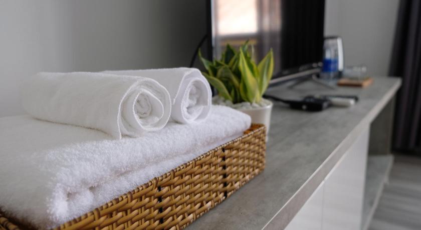 a white towel sitting on top of a white counter top, Vien Hotel in Cần Thơ