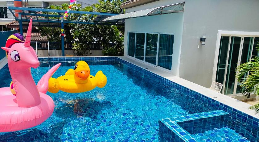 a swimming pool filled with colorful toys and balloons, Pool Villa Jomtien in Pattaya