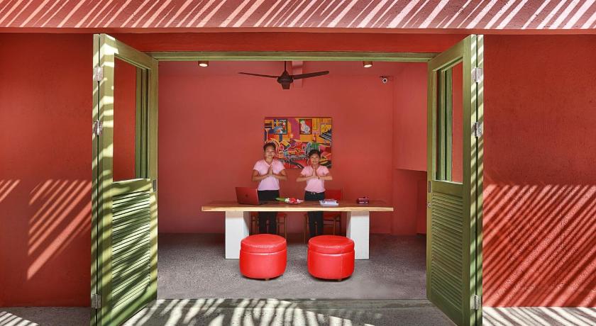 a room with a red chair and a red table, PinkCoco Gili Trawangan – for Cool Adults Only in Lombok
