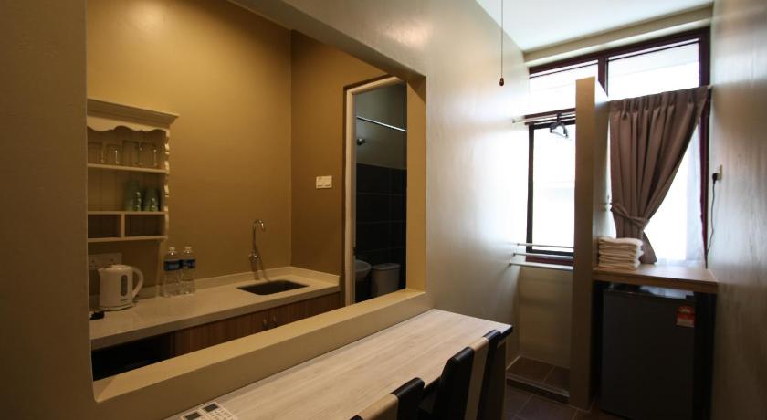 a bathroom with a sink and a mirror, Shamrock Greenhill in Ipoh