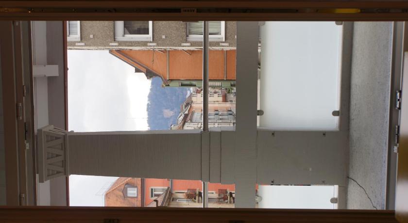 a reflection of a window in a mirror, Luxury Apartments by Livingdowntown in Zürich