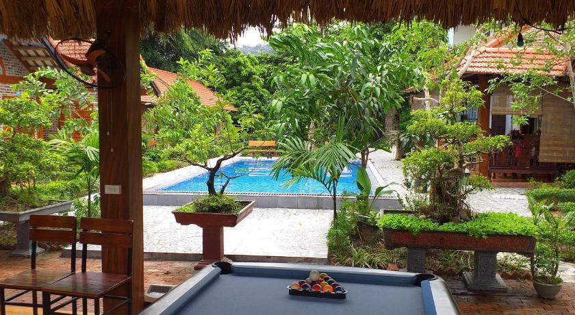 a patio area with a pool table and chairs, Tam Coc Melody Homestay in Ninh Bình