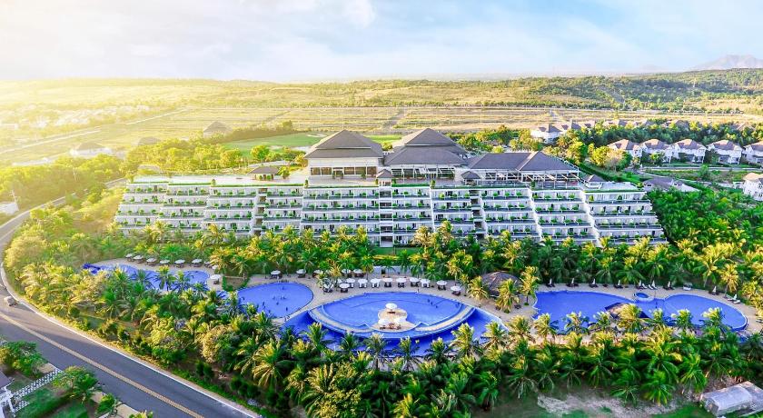 a large blue and white building with a large blue sky, Sea Links Beach Resort & Golf in Phan Thiet