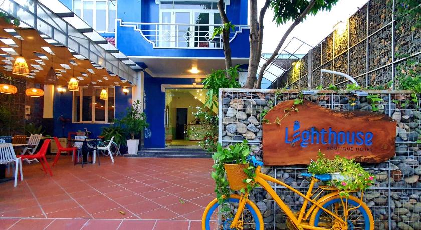 a bicycle parked in front of a brick building, Lighthouse Boutique Hotel in Côn Đảo Islands
