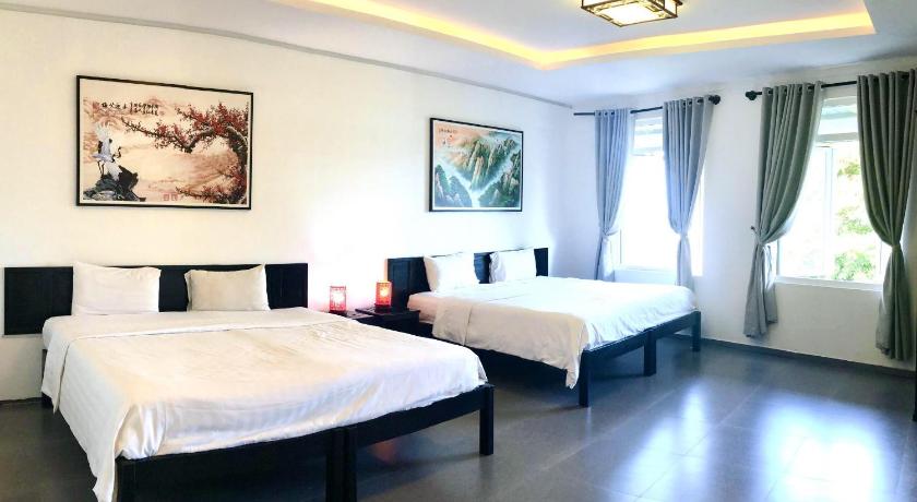 a hotel room with a large bed and a large window, Phu House Hostel in Phu Quoc Island