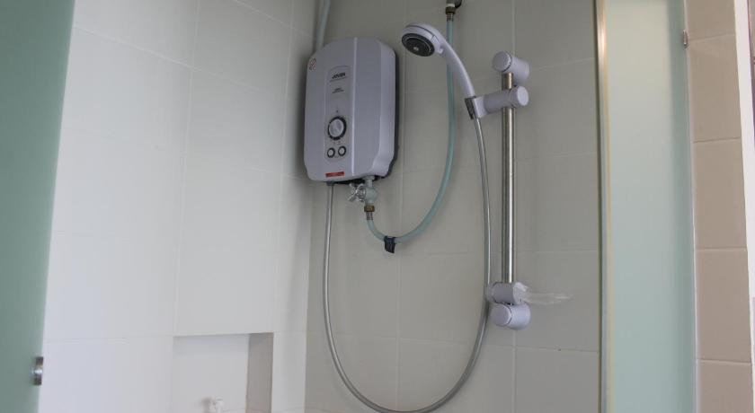 a shower with a remote control attached to it, ThreeFour GuestHouse for 2-6 at Trefoil Setia Alam in Shah Alam