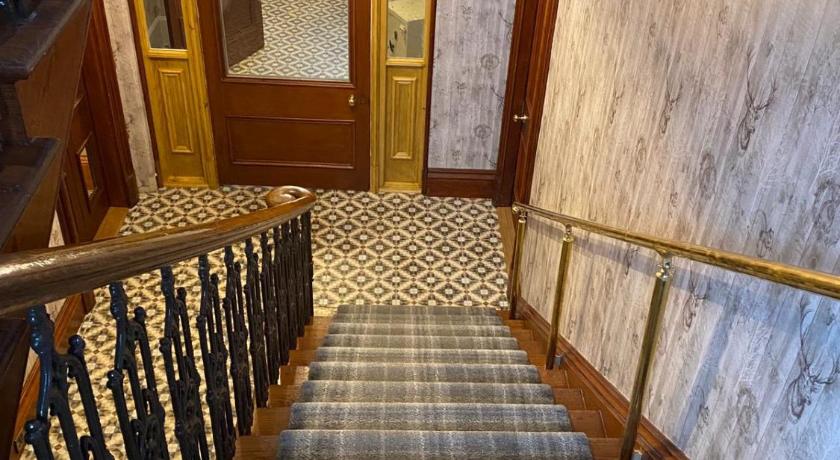 a row of stairs leading up to a staircase, Manor House in Thurso
