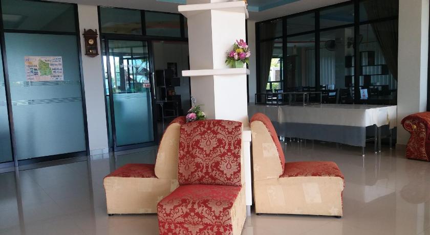 a room with a couch, chairs and a table, Kradung-nga Boutique Inn in Sisaket