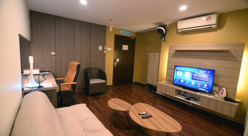 a living room filled with furniture and a tv, Nexus Regency Suites Hotel Subang Jaya in Shah Alam