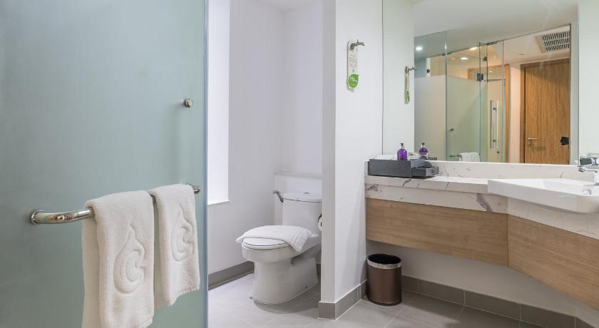 a bathroom with a toilet, sink, and shower, Centara Ao Nang Beach Resort & Spa Krabi (SHA Extra Plus) in Krabi