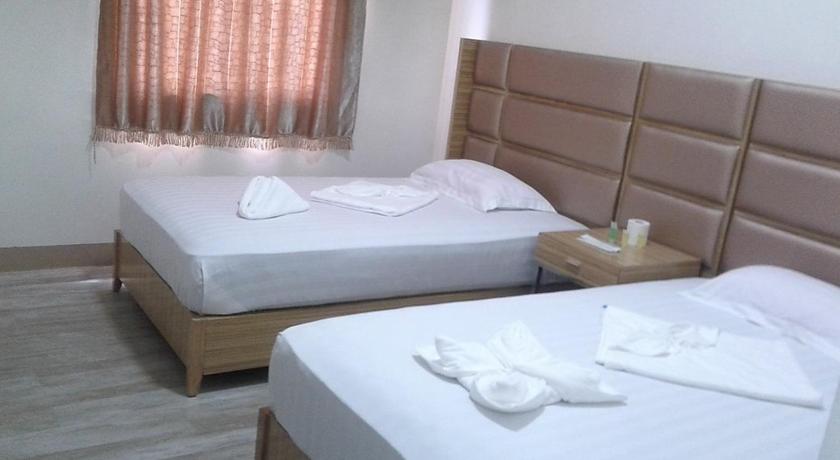 a hotel room with two beds and two lamps, Meaco Royal Hotel Calbayog in Eastern Samar