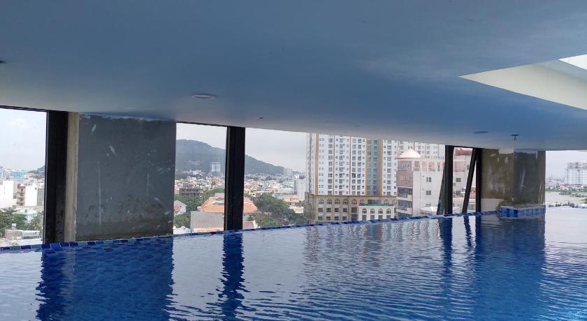 a large swimming pool in the middle of a city, Hong Hai 2 Hotel in Vung Tau