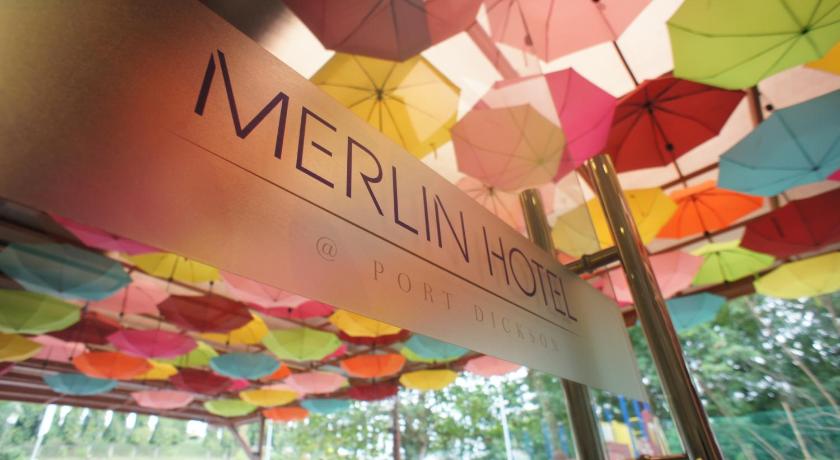a row of colorful umbrellas hanging from a ceiling, Merlin Hotel in Port Dickson