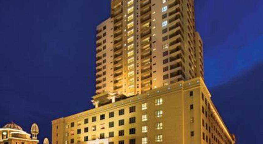 a large building with a large clock tower, New Town Suites in Kuala Lumpur