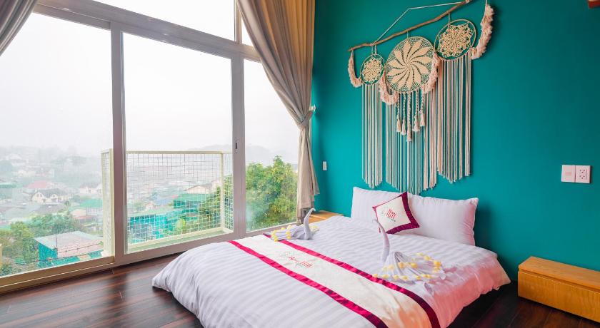 a bedroom with a bed and a window, Dalat Rose Hill Villa - Mountain View in Dalat