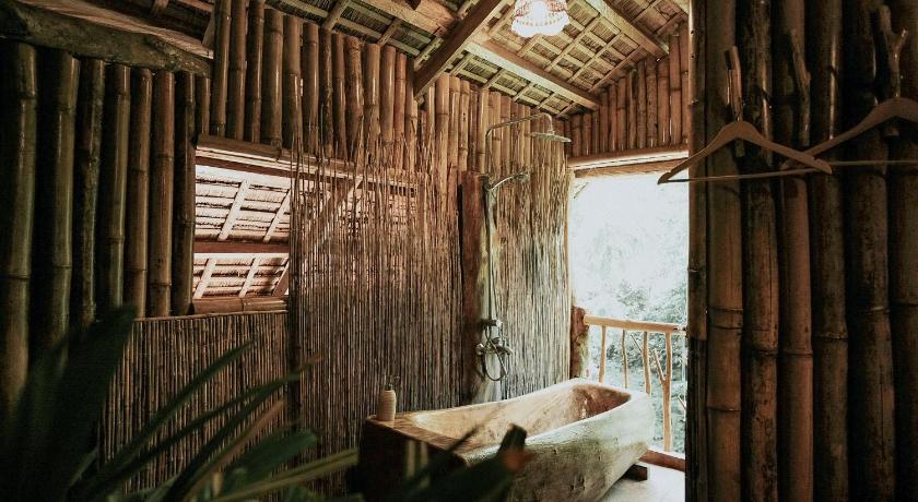 a room with a wooden floor and wooden walls, Treehouse de Valentine in Cebu