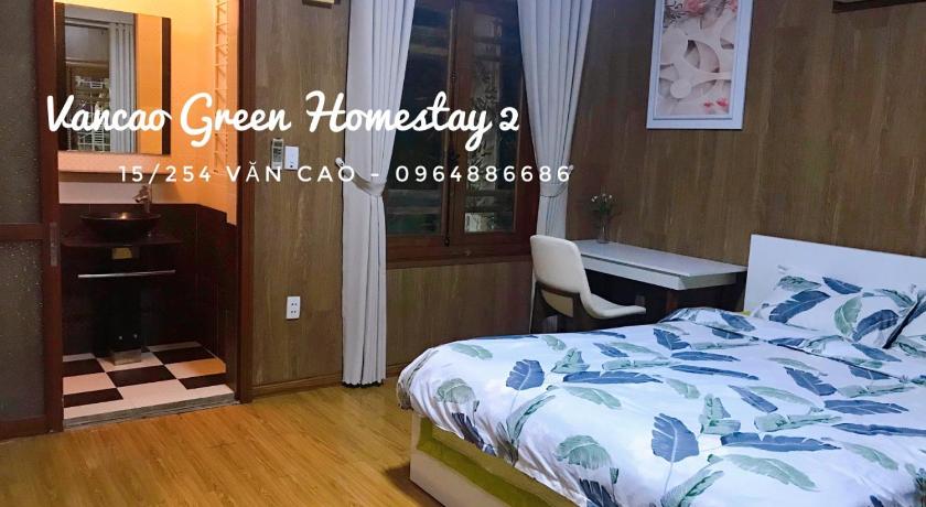 a bedroom with a bed and a desk, VanCao Green Homestay in Haiphong