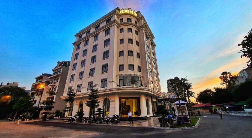 a large building with a clock on the side of it, Lotus Hotel & Apartment in Haiphong