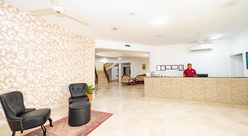 a living room filled with furniture and a large window, Oriental Nights Rest House in A'Sharqiyah Sands (Wahiba)