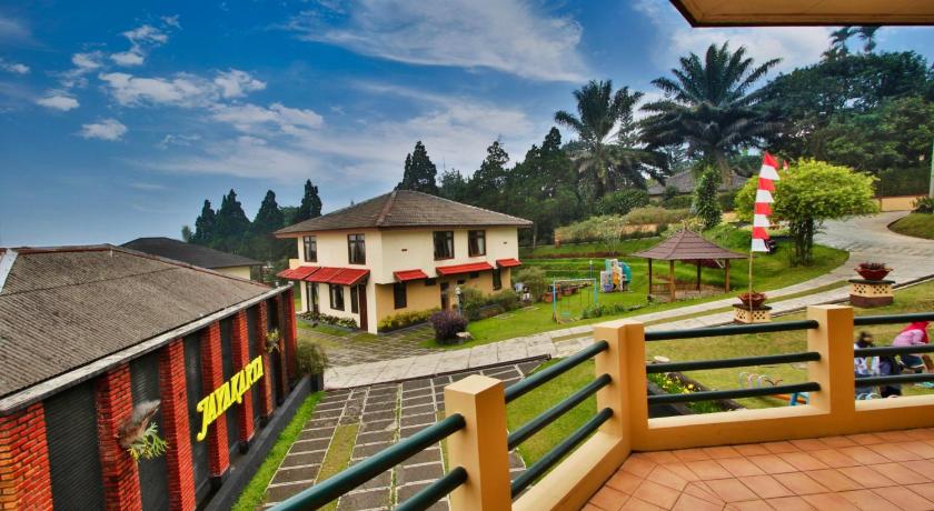 a large building with a view of a city, The Jayakarta Cisarua inn and villas in Puncak
