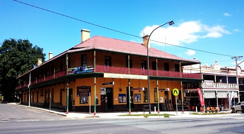 a brick building with a clock on the front of it, The Royal Mail Hotel Braidwood in Braidwood