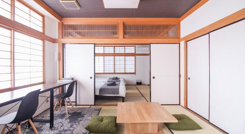 a living room filled with furniture and a window, Evergreen Hotel Hatsudai in Tokyo