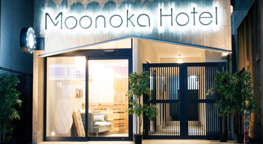 a large building with a sign on the front of it, Monoka Hotel Ginza in Tokyo